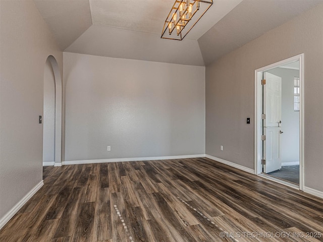 15412 E 78th St N, Owasso, OK 74055 - empty room featuring lofted ceiling, dark wood-style flooring, and baseboards