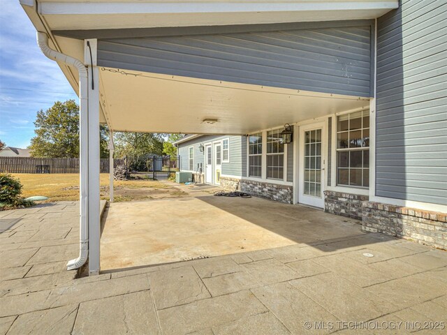 15412 E 78th St N, Owasso, OK 74055 - view of patio featuring fence and a carport