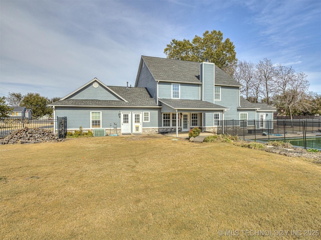 15412 E 78th St N, Owasso, OK 74055 - back of property with a chimney, roof with shingles, a patio area, and central AC unit