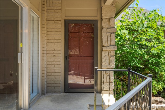 3901 E 60th Pl, Tulsa, OK 74135 - view of exterior entry featuring a balcony and stone siding