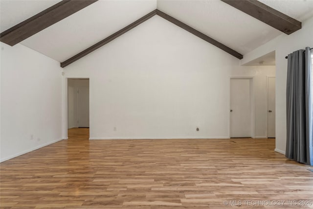 3901 E 60th Pl, Tulsa, OK 74135 - unfurnished living room with beamed ceiling, light wood-style flooring, high vaulted ceiling, and baseboards