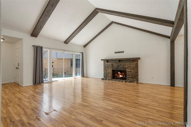 3901 E 60th Pl, Tulsa, OK 74135 - unfurnished living room with beam ceiling, light wood finished floors, a fireplace, high vaulted ceiling, and baseboards