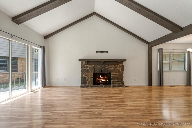 3901 E 60th Pl, Tulsa, OK 74135 - unfurnished living room with wood finished floors, beamed ceiling, a fireplace, high vaulted ceiling, and baseboards