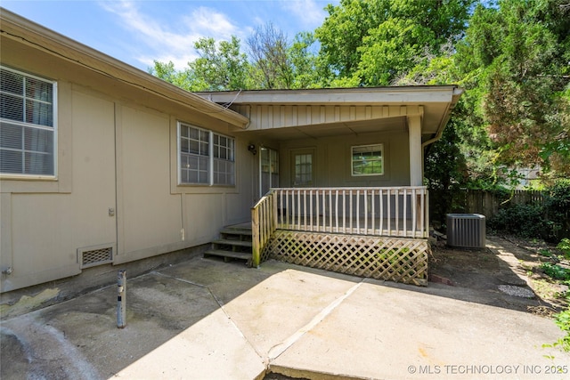 3901 E 60th Pl, Tulsa, OK 74135 - entrance to property with central AC unit, a porch, a patio, and fence