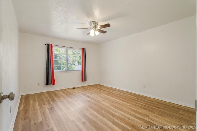 3901 E 60th Pl, Tulsa, OK 74135 - spare room featuring ceiling fan, light wood-type flooring, and baseboards
