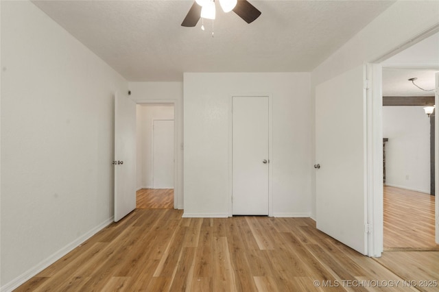 3901 E 60th Pl, Tulsa, OK 74135 - unfurnished bedroom featuring light wood-type flooring, baseboards, and ceiling fan