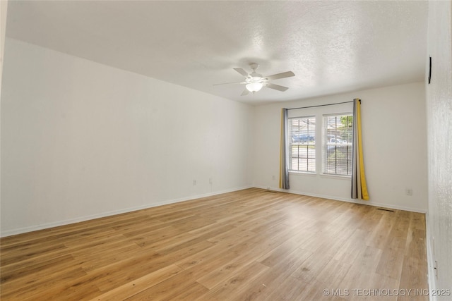 3901 E 60th Pl, Tulsa, OK 74135 - unfurnished room featuring ceiling fan, light wood-type flooring, baseboards, and a textured ceiling