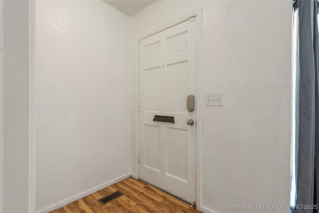3901 E 60th Pl, Tulsa, OK 74135 - doorway featuring baseboards and light wood-type flooring