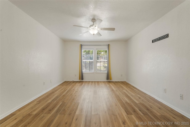 3901 E 60th Pl, Tulsa, OK 74135 - unfurnished room featuring a ceiling fan, light wood finished floors, and baseboards