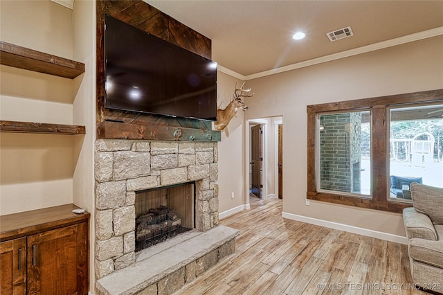 117683 Powell Rd, Eufaula, OK 74432 - unfurnished living room with crown molding, wood finished floors, baseboards, and a stone fireplace