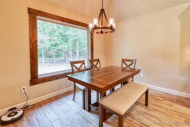 117683 Powell Rd, Eufaula, OK 74432 - dining space featuring a chandelier, baseboards, and light wood-style flooring