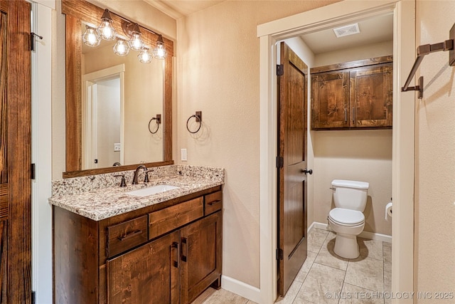 117683 Powell Rd, Eufaula, OK 74432 - bathroom featuring toilet, vanity, baseboards, tile patterned floors, and a textured wall