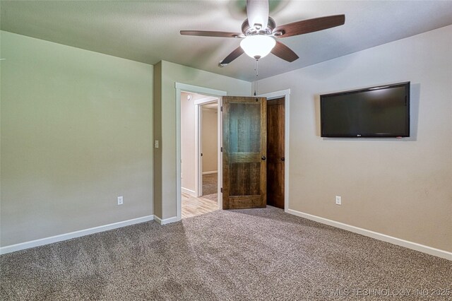 117683 Powell Rd, Eufaula, OK 74432 - unfurnished bedroom featuring carpet flooring, baseboards, and ceiling fan
