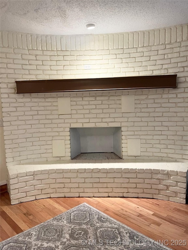 detailed view of a textured ceiling and wood finished floors