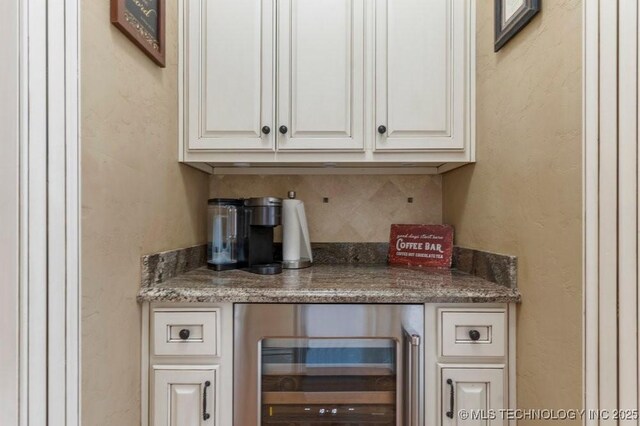 716 W 108th Pl S, Jenks, OK 74037 - indoor dry bar with beverage cooler, backsplash, and a textured wall