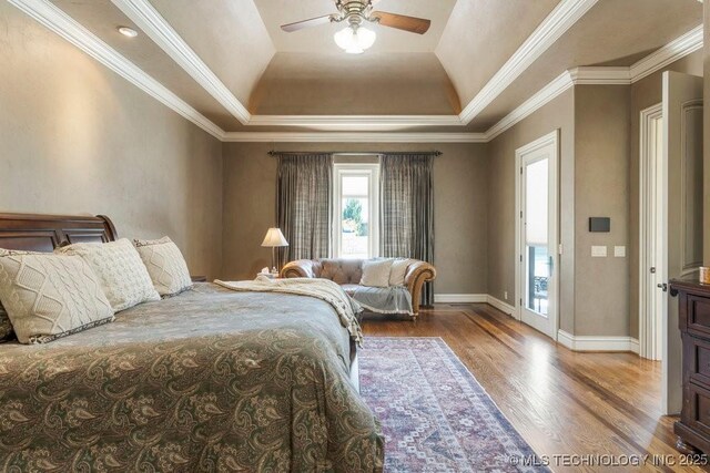 716 W 108th Pl S, Jenks, OK 74037 - bedroom featuring a raised ceiling, wood finished floors, baseboards, crown molding, and ceiling fan