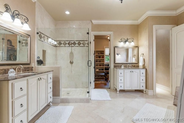 716 W 108th Pl S, Jenks, OK 74037 - bathroom with a stall shower, ornamental molding, two vanities, and a spacious closet