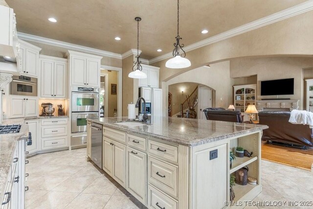 716 W 108th Pl S, Jenks, OK 74037 - kitchen featuring a sink, arched walkways, stainless steel appliances, open floor plan, and crown molding