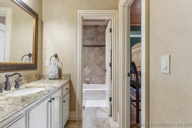 716 W 108th Pl S, Jenks, OK 74037 - bathroom featuring vanity, tub / shower combination, a textured wall, and tile patterned flooring