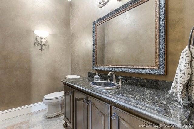 716 W 108th Pl S, Jenks, OK 74037 - bathroom featuring toilet, vanity, and baseboards