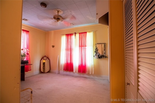 unfurnished bedroom featuring carpet and baseboards