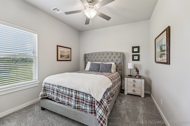 carpeted bedroom featuring baseboards and ceiling fan