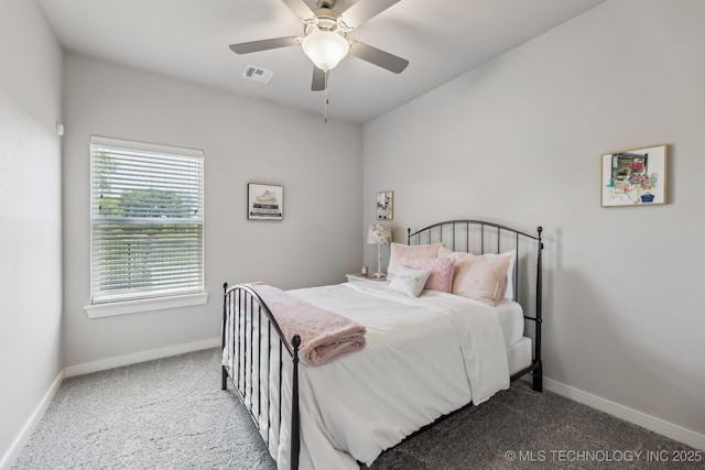 bedroom featuring carpet floors, baseboards, and a ceiling fan
