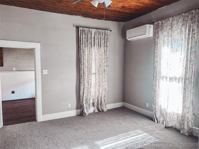 216 Belt Ave, Eufaula, OK 74432 - empty room with a wall mounted air conditioner, wooden ceiling, a ceiling fan, carpet floors, and baseboards