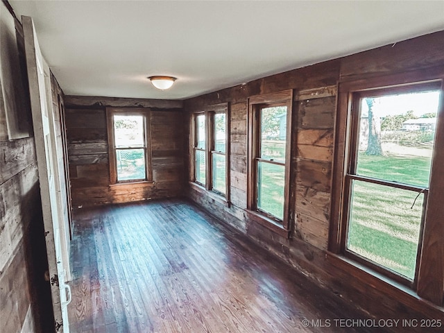 216 Belt Ave, Eufaula, OK 74432 - spare room with wood walls and dark wood-style flooring