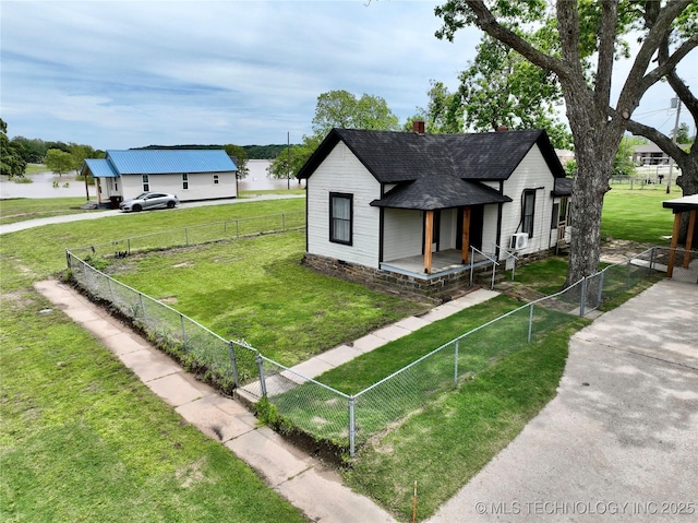 216 Belt Ave, Eufaula, OK 74432 - view of side of property with covered porch, roof with shingles, and a chimney