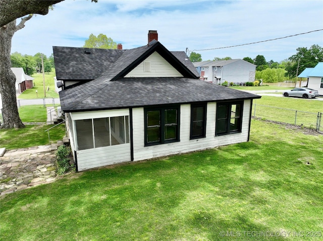216 Belt Ave, Eufaula, OK 74432 - back of property with roof with shingles, a chimney, and a sunroom