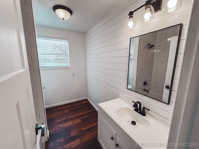 216 Belt Ave, Eufaula, OK 74432 - full bath featuring wooden walls, a shower, vanity, wood finished floors, and baseboards