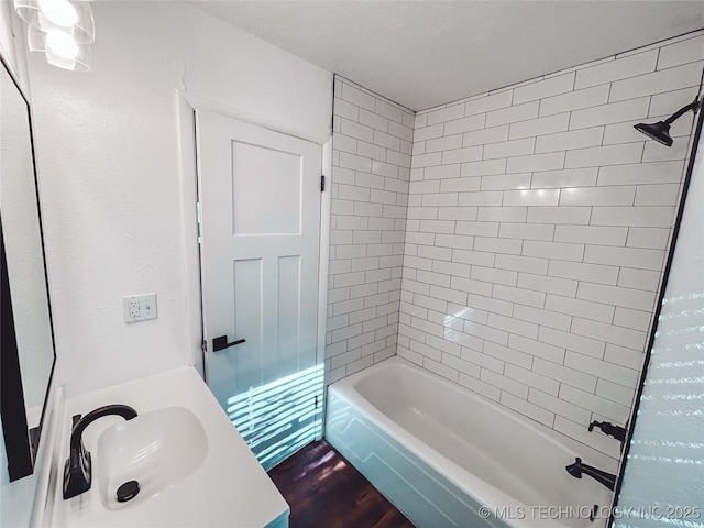 216 Belt Ave, Eufaula, OK 74432 - bathroom featuring wood finished floors, vanity, and shower / tub combination