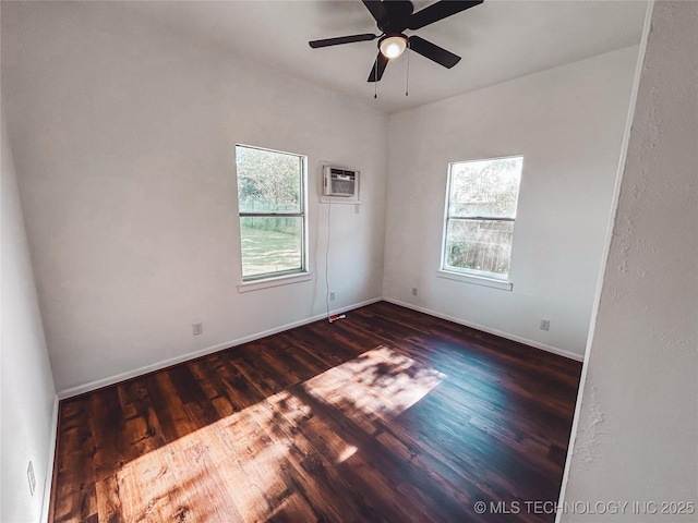 216 Belt Ave, Eufaula, OK 74432 - unfurnished room with dark wood-type flooring, a wall mounted air conditioner, baseboards, and a ceiling fan