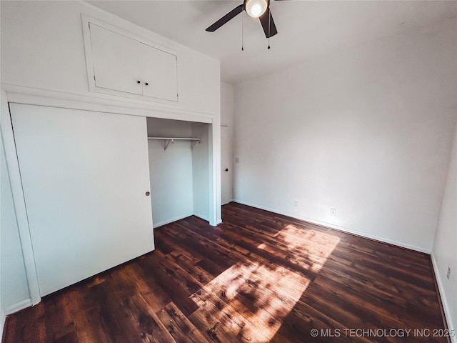 216 Belt Ave, Eufaula, OK 74432 - unfurnished bedroom featuring dark wood finished floors, a closet, and ceiling fan