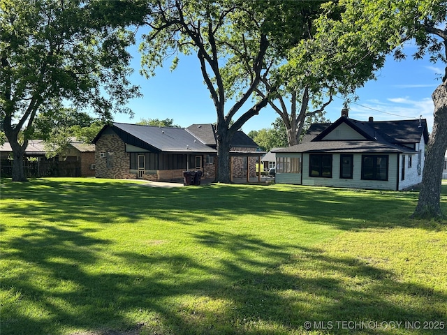 216 Belt Ave, Eufaula, OK 74432 - rear view of property featuring a lawn and stone siding