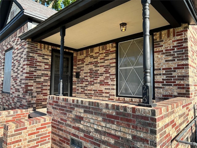 216 Belt Ave, Eufaula, OK 74432 - property entrance with covered porch and brick siding