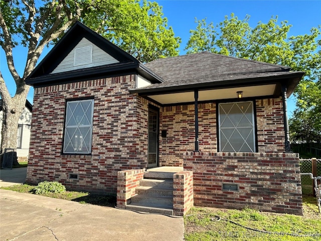 216 Belt Ave, Eufaula, OK 74432 - view of front of property featuring brick siding and roof with shingles