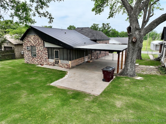 216 Belt Ave, Eufaula, OK 74432 - rear view of house featuring a metal roof, a sunroom, driveway, a carport, and stone siding