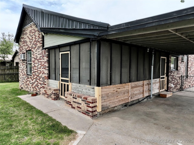 216 Belt Ave, Eufaula, OK 74432 - view of home's exterior featuring brick siding, an attached carport, and board and batten siding