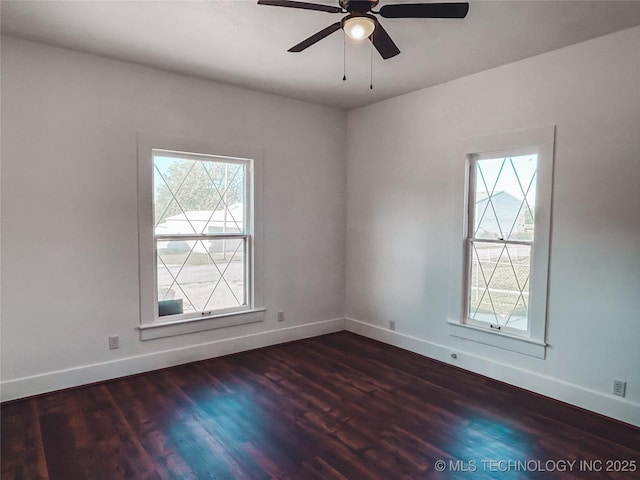 216 Belt Ave, Eufaula, OK 74432 - empty room with healthy amount of natural light, wood finished floors, and ceiling fan