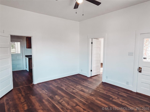 216 Belt Ave, Eufaula, OK 74432 - unfurnished room featuring a ceiling fan, dark wood-style floors, and baseboards