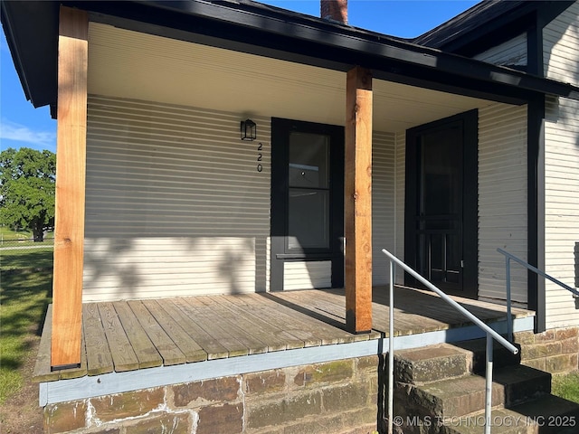 216 Belt Ave, Eufaula, OK 74432 - doorway to property with covered porch and a chimney