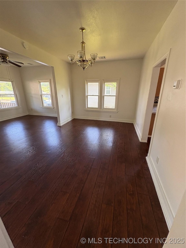 108 N Creek Ave, Bartlesville, OK 74003 - unfurnished room with a chandelier, dark wood-style floors, baseboards, and ceiling fan