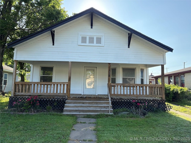 108 N Creek Ave, Bartlesville, OK 74003 - view of front of home featuring a porch and a front yard