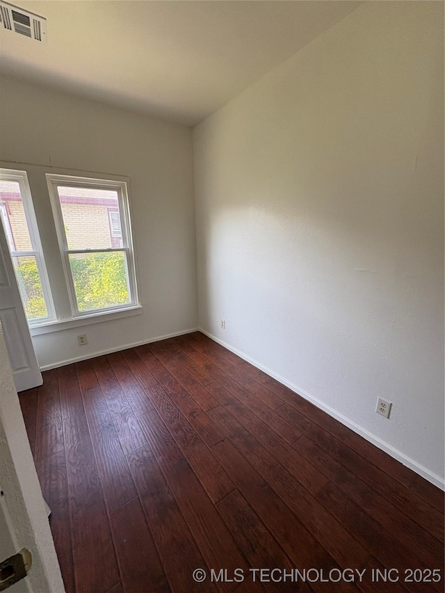 108 N Creek Ave, Bartlesville, OK 74003 - spare room with dark wood-style floors and baseboards
