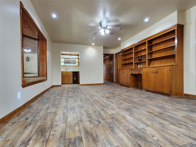 unfurnished living room featuring ceiling fan, wood finished floors, baseboards, and recessed lighting