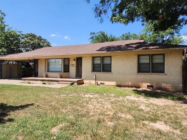 single story home featuring brick siding, crawl space, an attached carport, a porch, and roof with shingles
