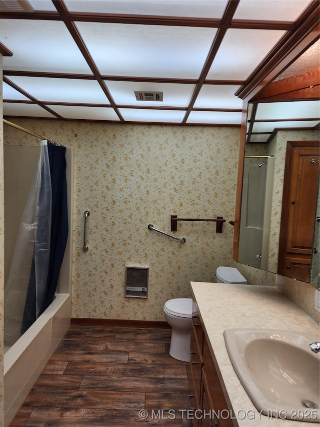 full bathroom with wood finished floors, toilet, vanity, and baseboards