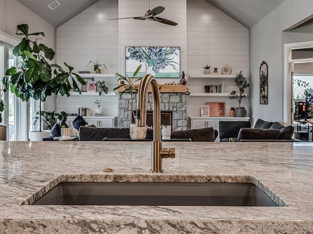 13606 S 21st Pl E, Bixby, OK 74008 - kitchen with vaulted ceiling, a sink, a fireplace, open floor plan, and healthy amount of natural light